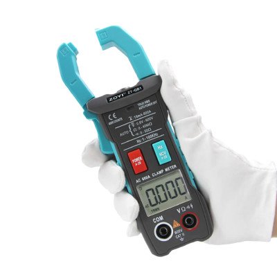 ZT-QB1 handheld clamp multimeter showing inrush/peak hold reading
